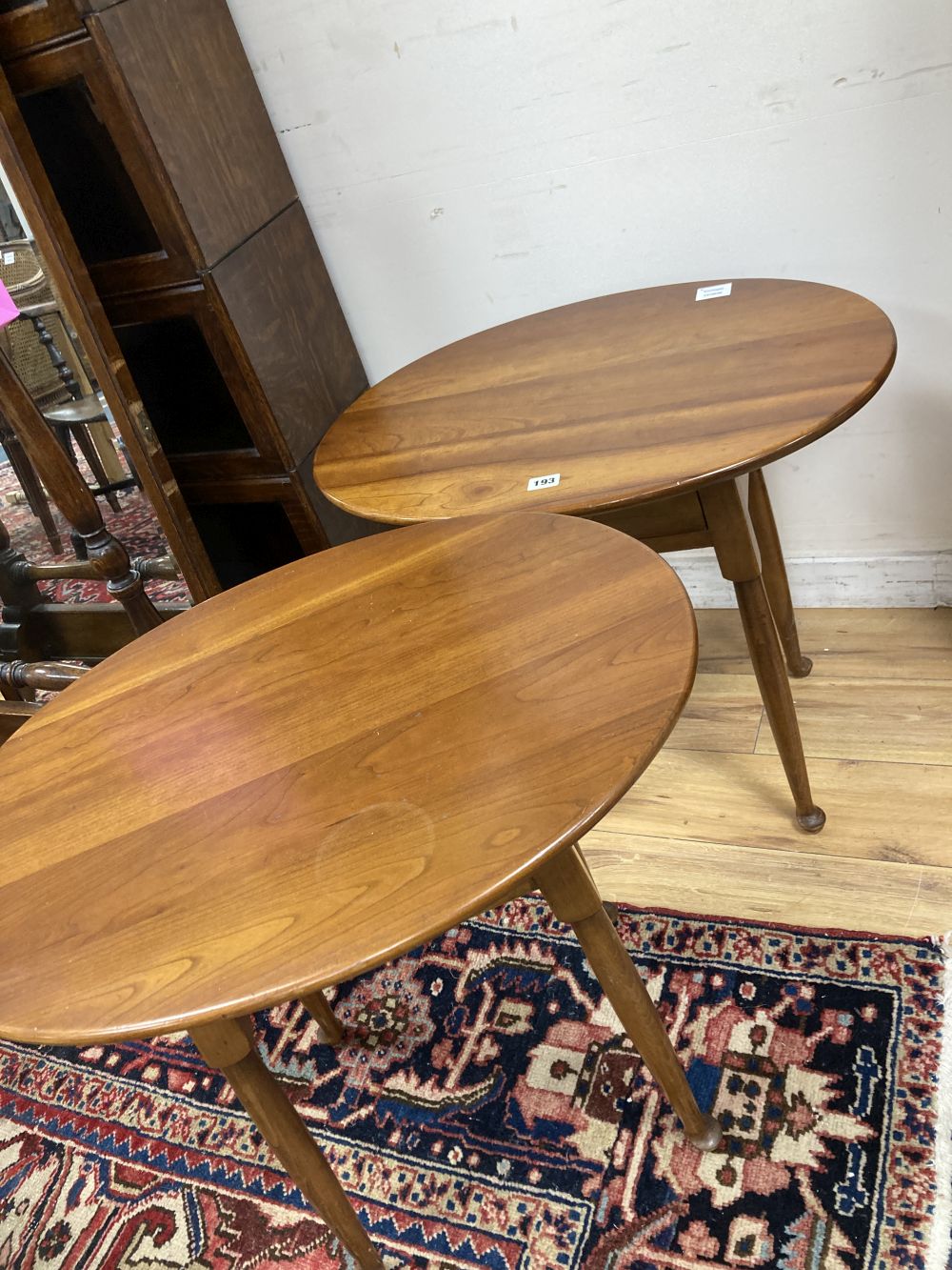 A pair of Leopold Stickley cherrywood side tables, width 65cm depth 49cm height 58cm